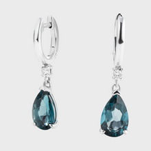 Ma. Metal Earring with Topaz